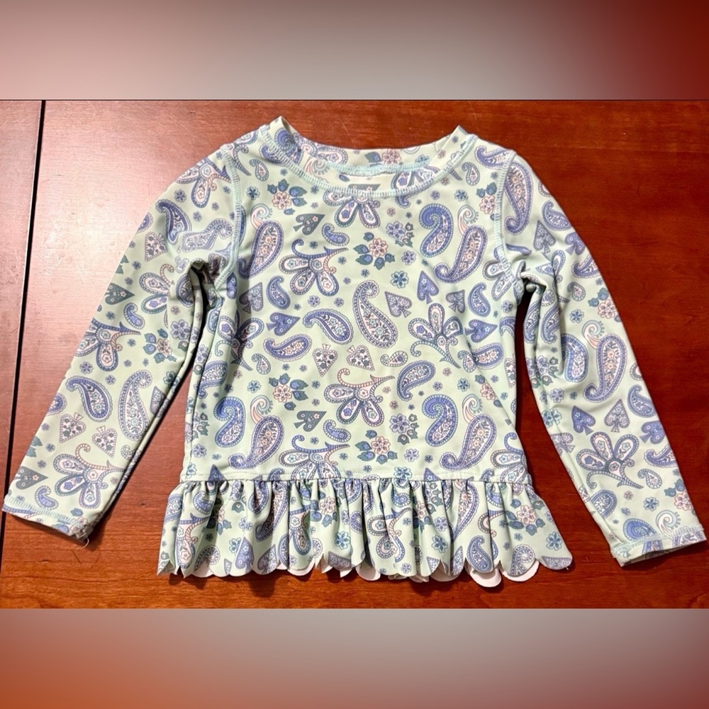RuffleButts • Sea Glass
Paisley Rash Guard • Size 3t - Picture 2 of 7
